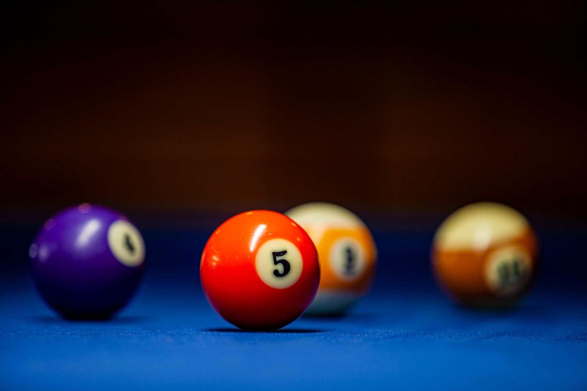 vibrant pool balls on blue table